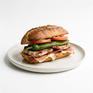 Bocadillo De Tortilla Patata + Bacon + Salsa