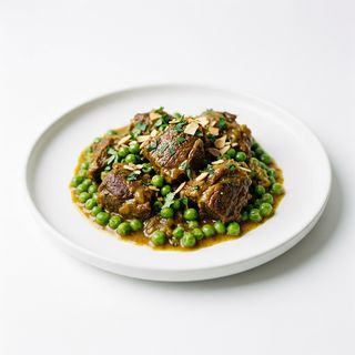 Carne De Cordero Con Guisantes