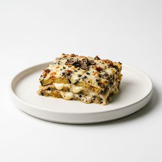 Parmigiana bianca con salsa tartufata
