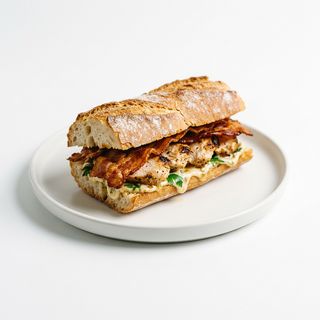 Bocadillo De Pollo Empanado + Bacon + Huevo Duro + Salsa