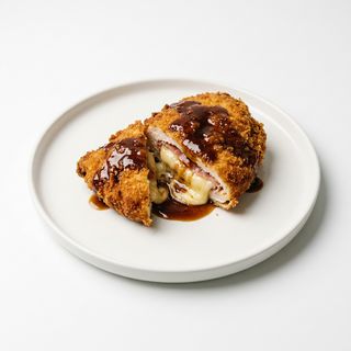 Aneto con salsa de champiñones