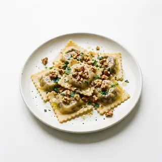 Ravioli De Berenjena Con Queso De Cabra Y Nueces