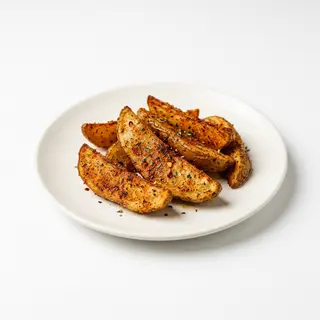 Media Ración De Patatas Wedges Picantes