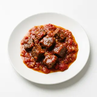 Ración De Carne Con Tomate
