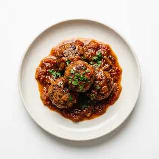 Ración De Albóndigas En Salsa
