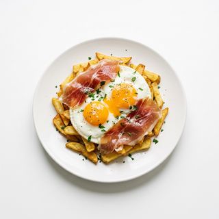 Huevos Rotos Con Jamón De Bodega (Ración)