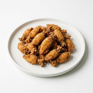 24. Chipirones Empanados (Ración)
