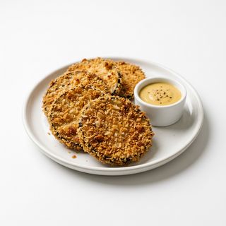 Berenjena crujiente con salsa de miel y mostaza
