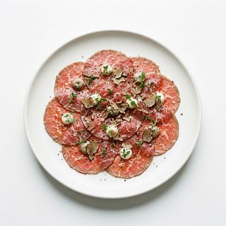 Carpaccio De Carne Con Crema De Trufa