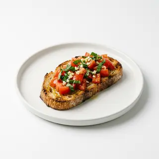 Bruschetta de tomate, albahaca y ajo