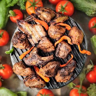 Goat Nyama Choma Pan Fried served with  half chips and half rice