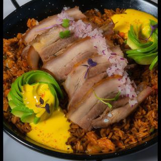 Arroz criollo con panceta confitada