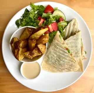 Chicken and Cheese Quesadilla with Rosemary roasted potato wedges, mini garden salad and honeylime dressing.