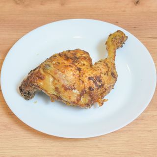Coscia di pollo con patate fritte