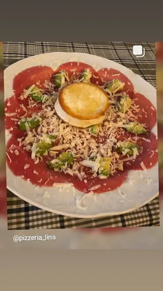 Carpaccio de angus con queso de cabra