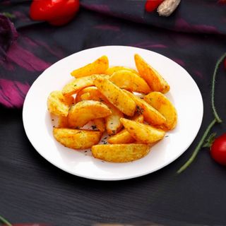 Картофельные дольки в травах