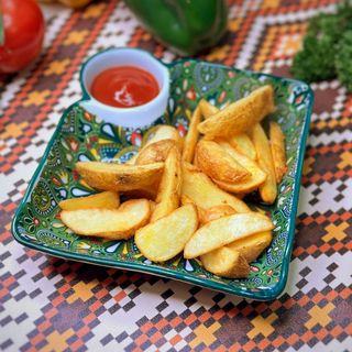 Картофельные дольки  с чесноком