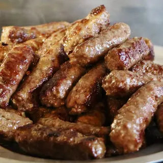 Juneći ćevapi u lepinji + luk + coca cola 0.33l