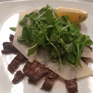 Tagliata di manzo parmigiano e rucola