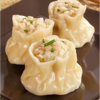 25. Siu-Mai De Trufa Con Pollo   Al Vapor (4 uds.)