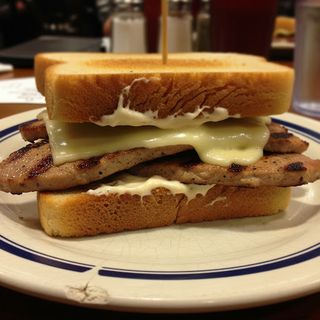 Bocadillo De Lomo Con Queso Y Alioli