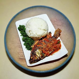 Fish(tilapia) wetfry with ugali (sima) and greens