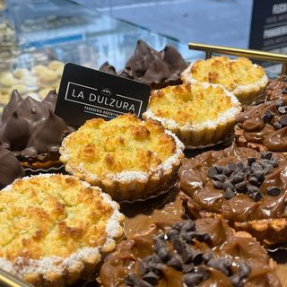 Porción de tarta  de Coco y Dulce de leche 