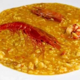 Arroz caldoso con sepia, rape y almejas (ración) 