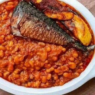 Nigerian beans, plantains and Titus Fish with drinking water 