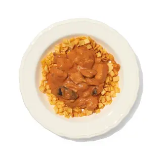 Muslitos de pollo deshuesados en salsa caliente