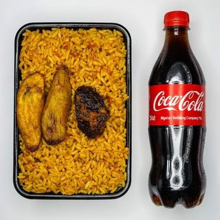A Plate Of Rice With Beef + Coca cola Original PET