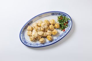 Қуырылган тұшпара кілегейлі тұздықта/Жареные пельмени в сливочном соусе (А)