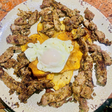 Taquitos de añojo al ajillo 