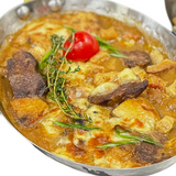 Телешки задушен език с шкембе в масло и кашкавал