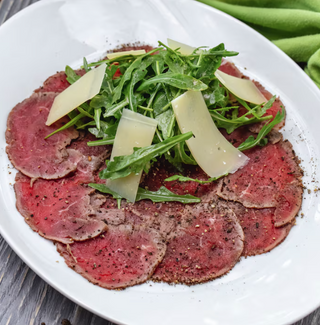 Carpaccio De Ternera Retinta Con Rúcula Y Parmesano