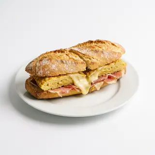 Bocadillo De Tortilla Con Jamón Y Queso