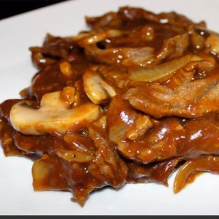 Ternera con champiñones