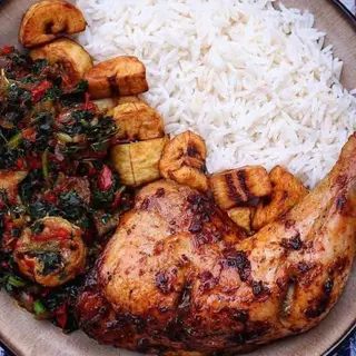 White rice served with eforiro, plantains and chicken
