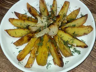 Картопля запечена з цибулькою та часничком (250g)