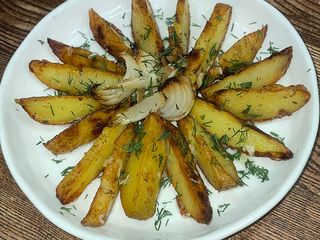 Картопля запечена з цибулькою та часничком (250g)