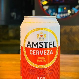 * CERVEZA AMSTEL ORIGINAL LATA