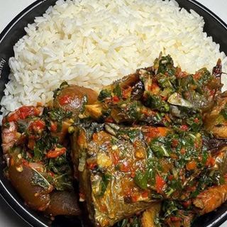 White rice served with eforiro mixed with titus fish and pomo 