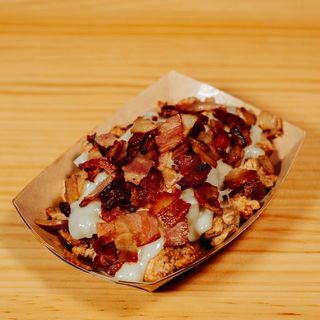 Pollo marinado con queso raclette DOP y bacon