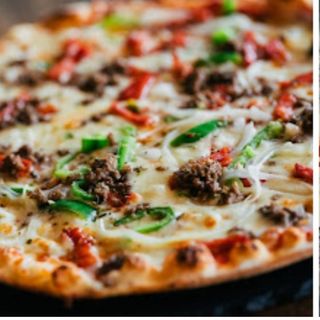 Pizza De La Casa (Mediana)