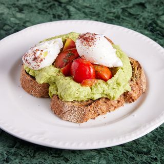Toast with avocado, poached eggs and and Cherry Tomatoes