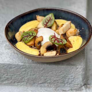 Buckwheat with poched egg, chicken & mushrooms mix served bearnaise sauce