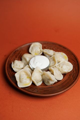 Пельмені з куркою та сиром зі сметаною(250/50г)