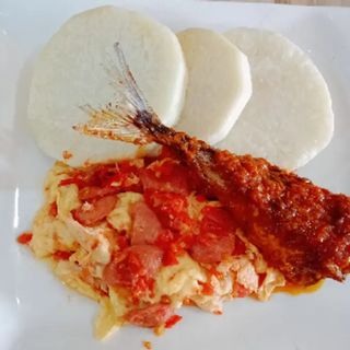 Boiled yam +  Egg sauce + diced sausages + Titus fish
