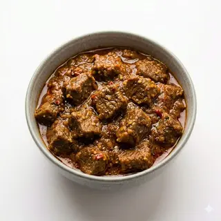 62. Cordero Cocinado En Salsa Picante