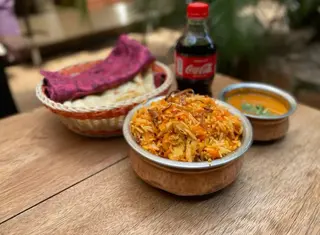 Chicken Biryani + gravy and Coca-Cola Original